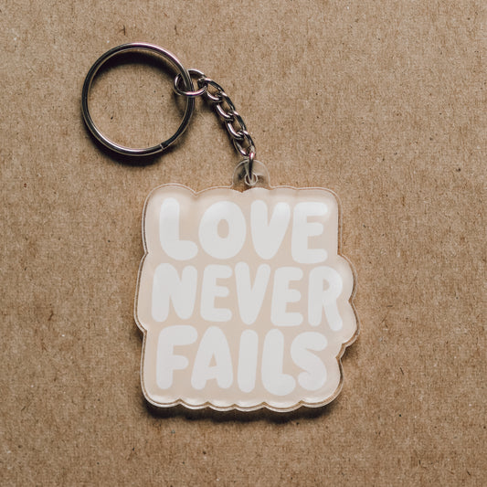 Love Never Fails Acrylic Keychain